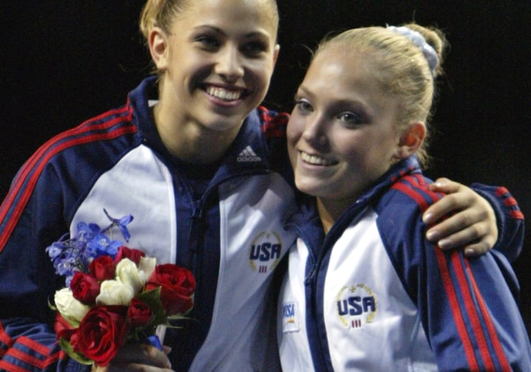 Courtney Kupets of Gaithersburg, Md. and Courtney McCool of Lee's Summit, Mo., right, smile after being announced as the two top spots for the women's team in Athens after the women's final round of the 2004 Olympic gymnastics team trials in Anaheim, Calif., Sunday, June 27, 2004.  (AP Photo/Amy Sancetta)